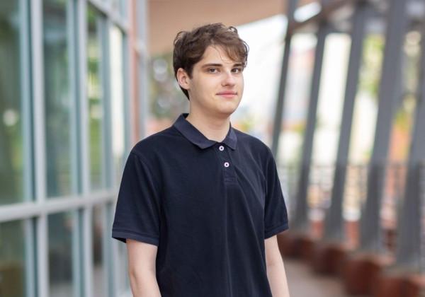 Student Jordan O'Kelley wearing a black polo shirt